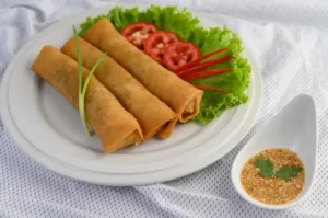 Traditional egg roll filling with beef and cabbage in a skillet