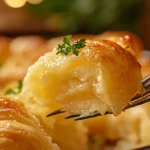 Can You Freeze Crescent Rolls? The Ultimate Guide 5 Golden baked crescent roll with melted butter glistening, garnished with parsley.