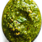 Pistachio Pesto: A beautiful bowl of vibrant green homemade Pistachio Pesto, ready to serve.